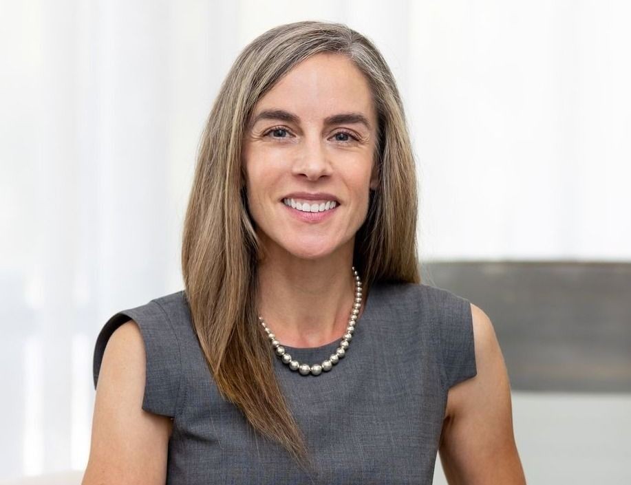 Model in casual lingerie setting indoors.