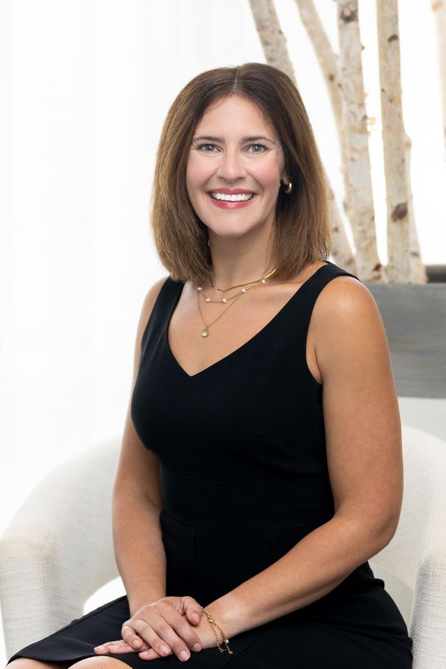 Textured surface with water droplets and reflections.