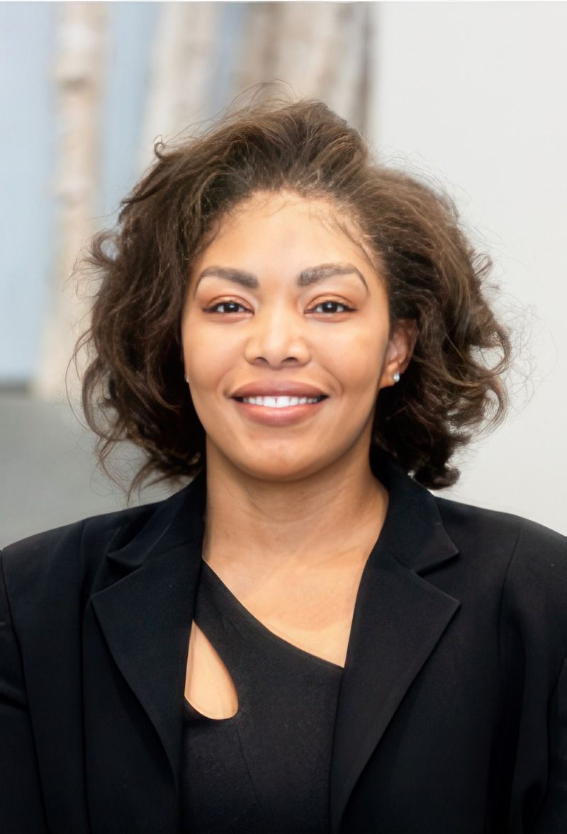Smiling woman in professional attire.