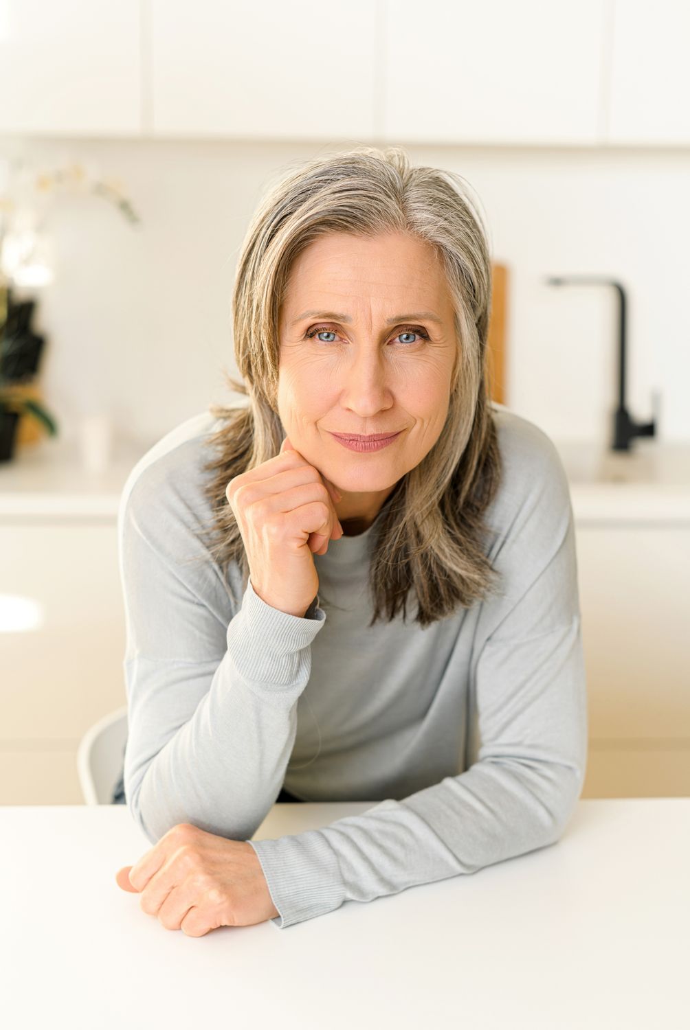 Portrait of a woman with long brown hair.