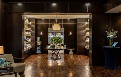 Elegant spa reception area with products displayed.